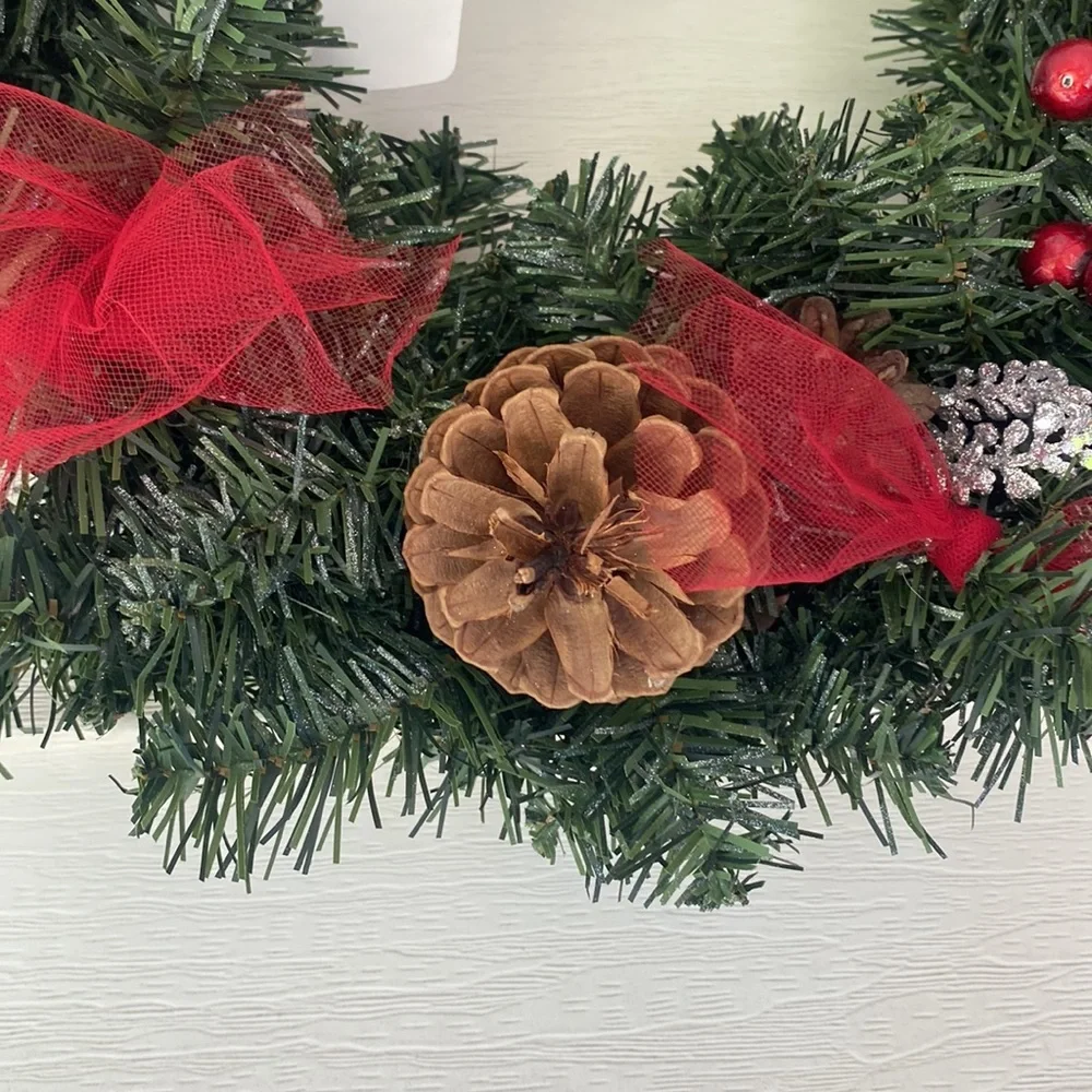 Evergreen Faux Wreath Trimmed with red accents and pine ones